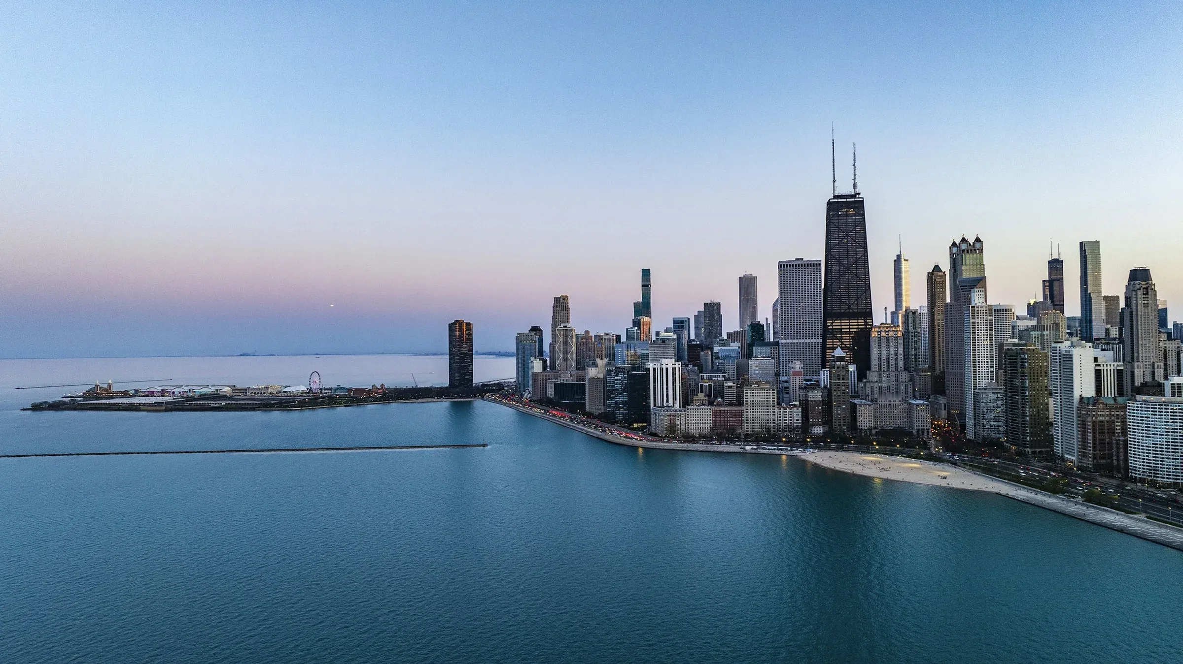 The Chicago lakefront at dusk from above Lake Michigan: Navy Pier, Oak Street Beach and the John Hancock Center