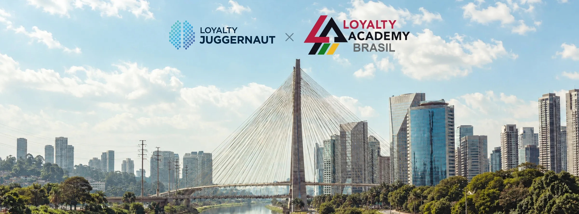 The Loyalty Juggernaut and Loyalty Academy Brasil logos over the Octavio Frias de Oliveira cable-stayed bridge in Sao Paulo