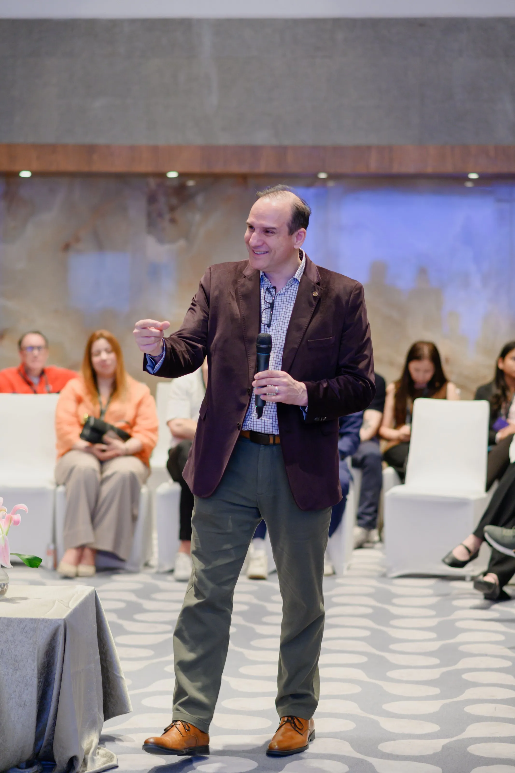 A speaker addressing the audience at a Loyalty Juggernaut event