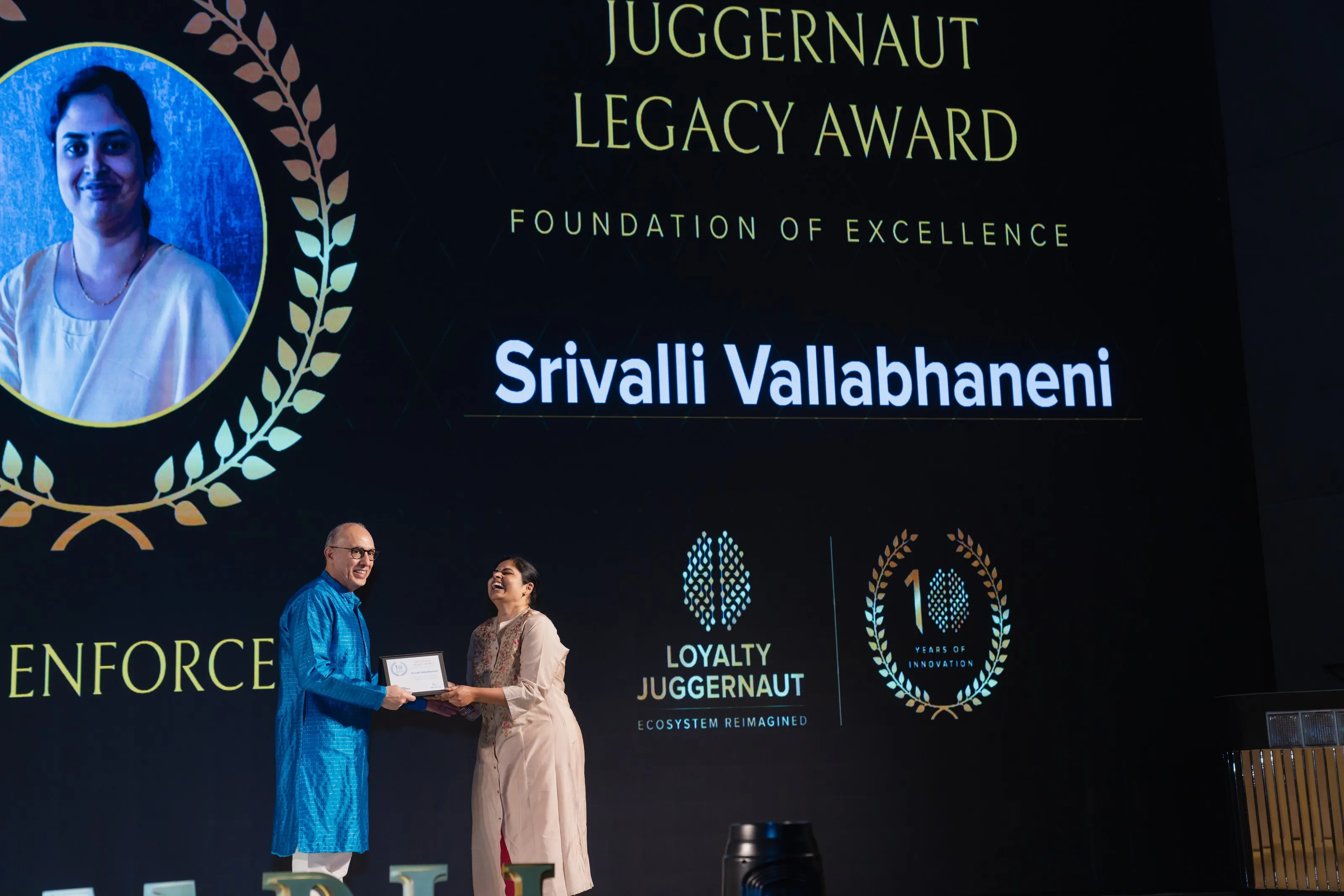 The Juggernaut Legacy Award presented on stage at a Loyalty Juggernaut event