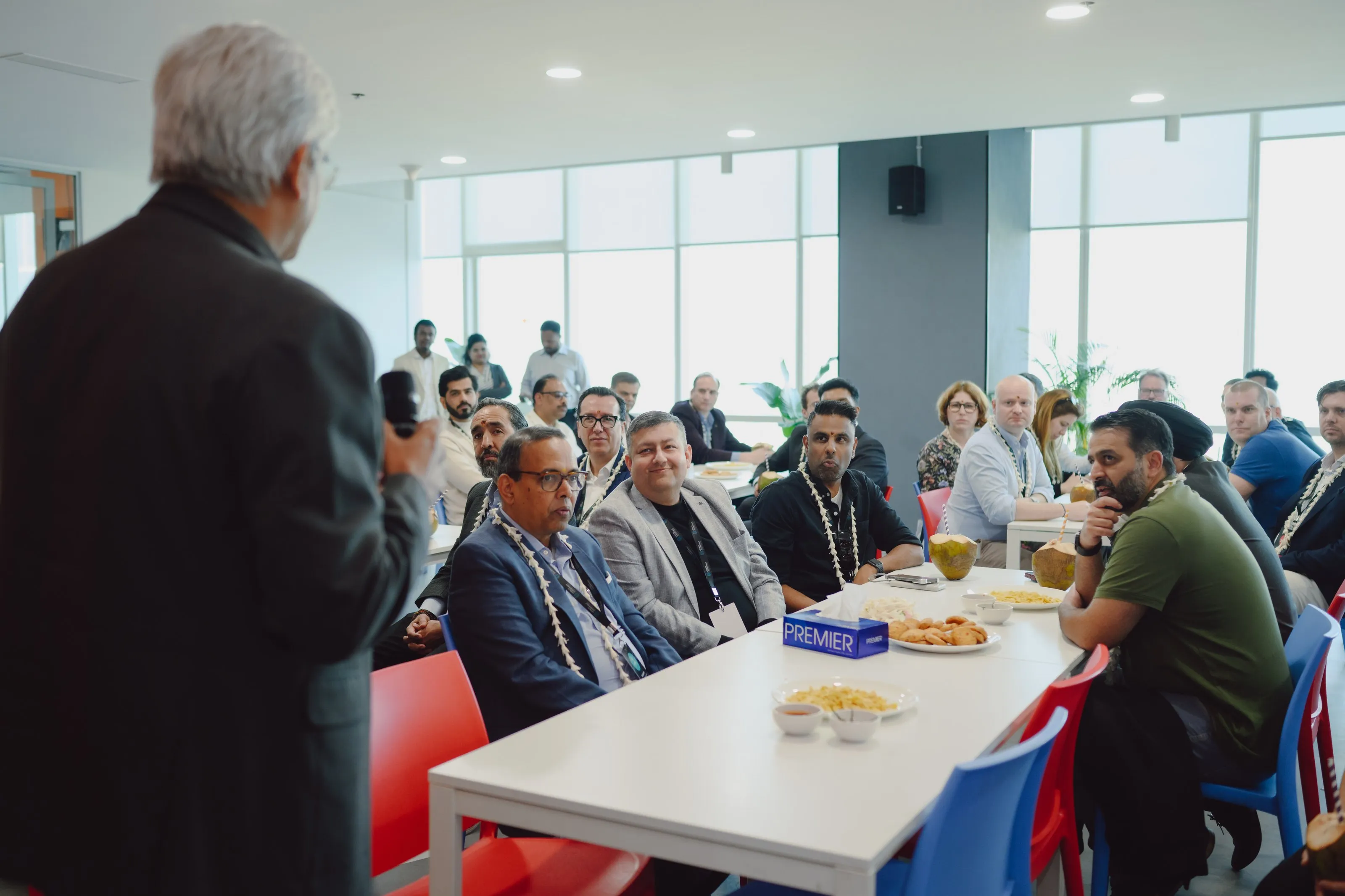 Loyalty Juggernaut team members talking over lunch at a company event
