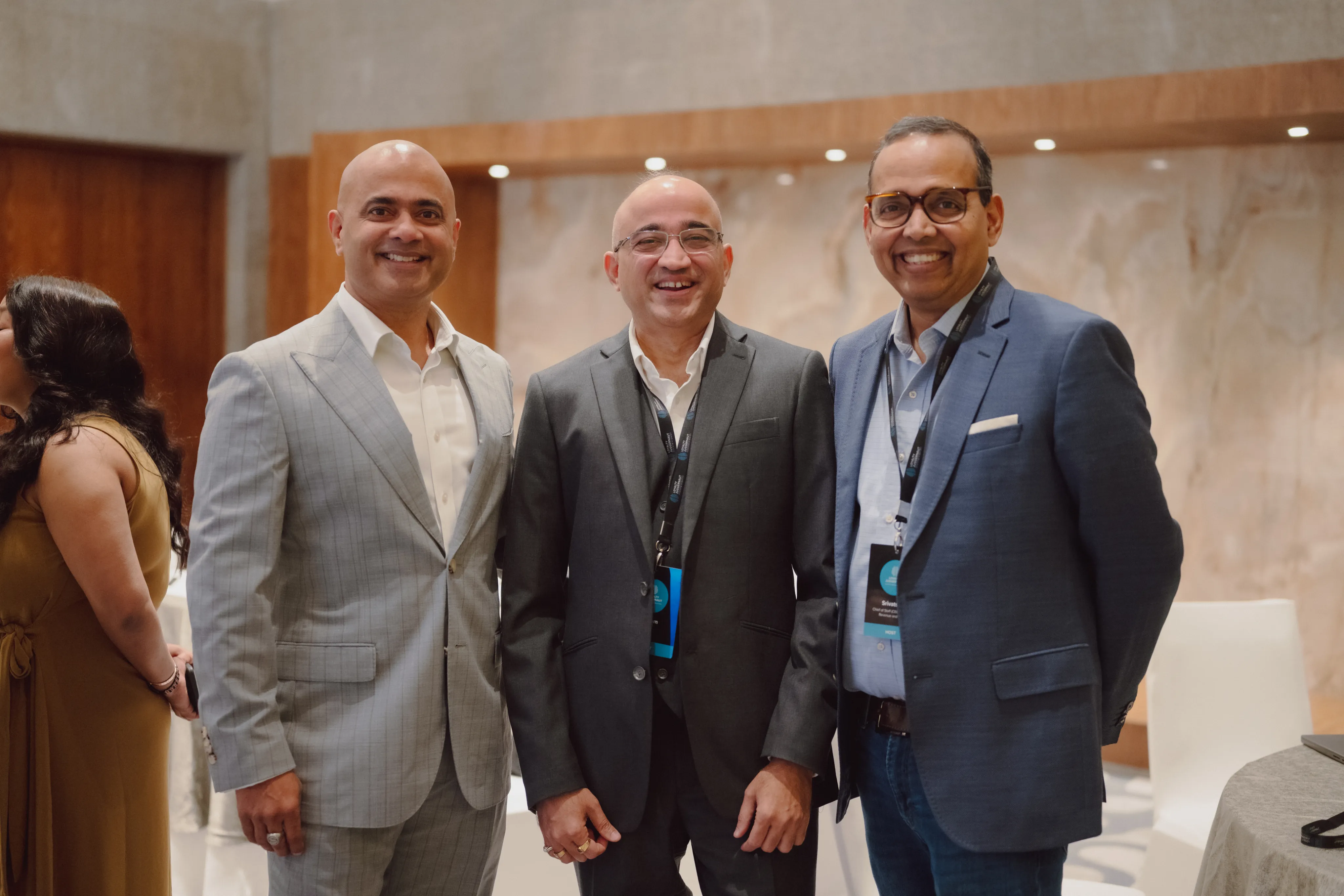 Three Loyalty Juggernaut leaders smiling together at a company event