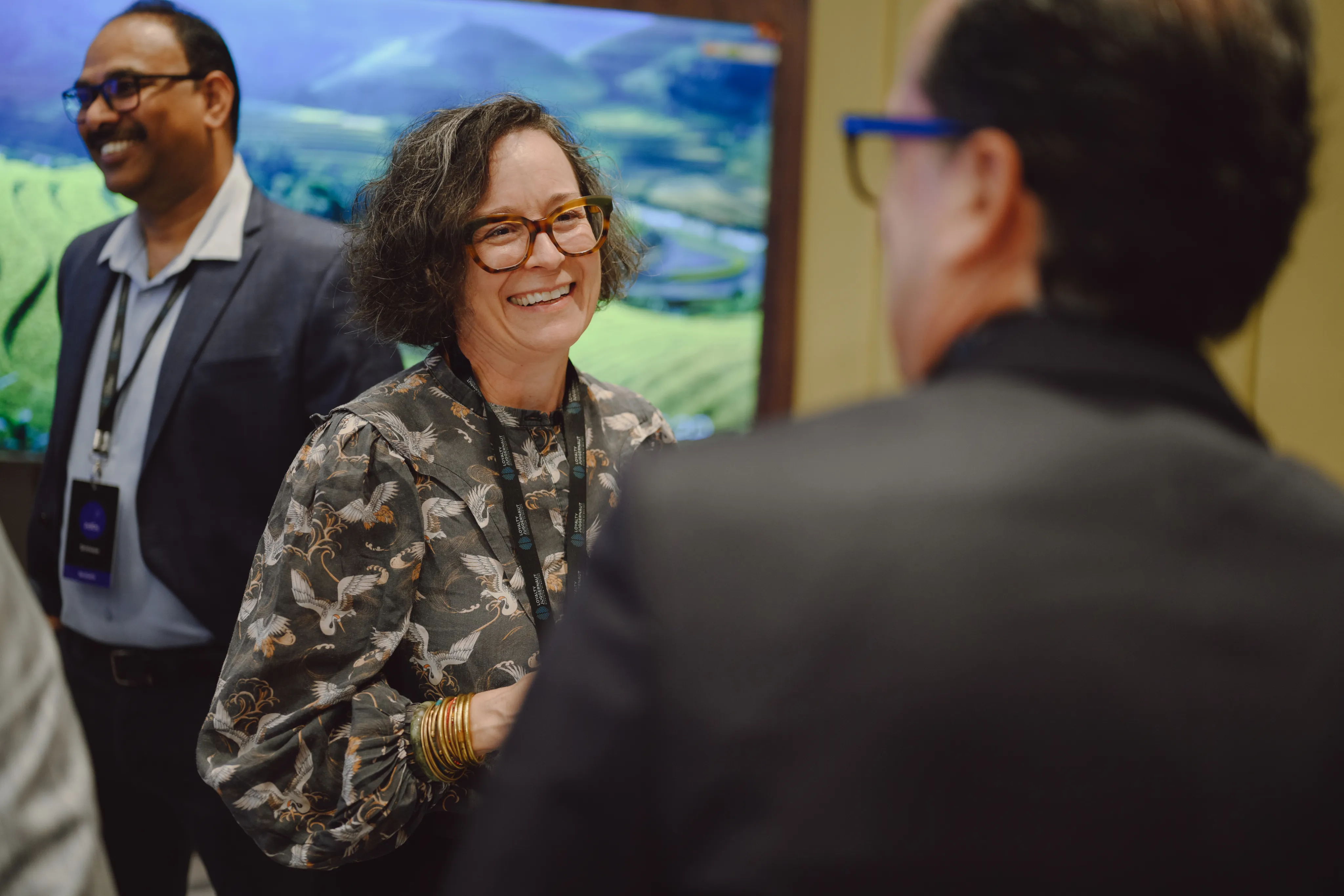 Loyalty Juggernaut team members talking at a company event