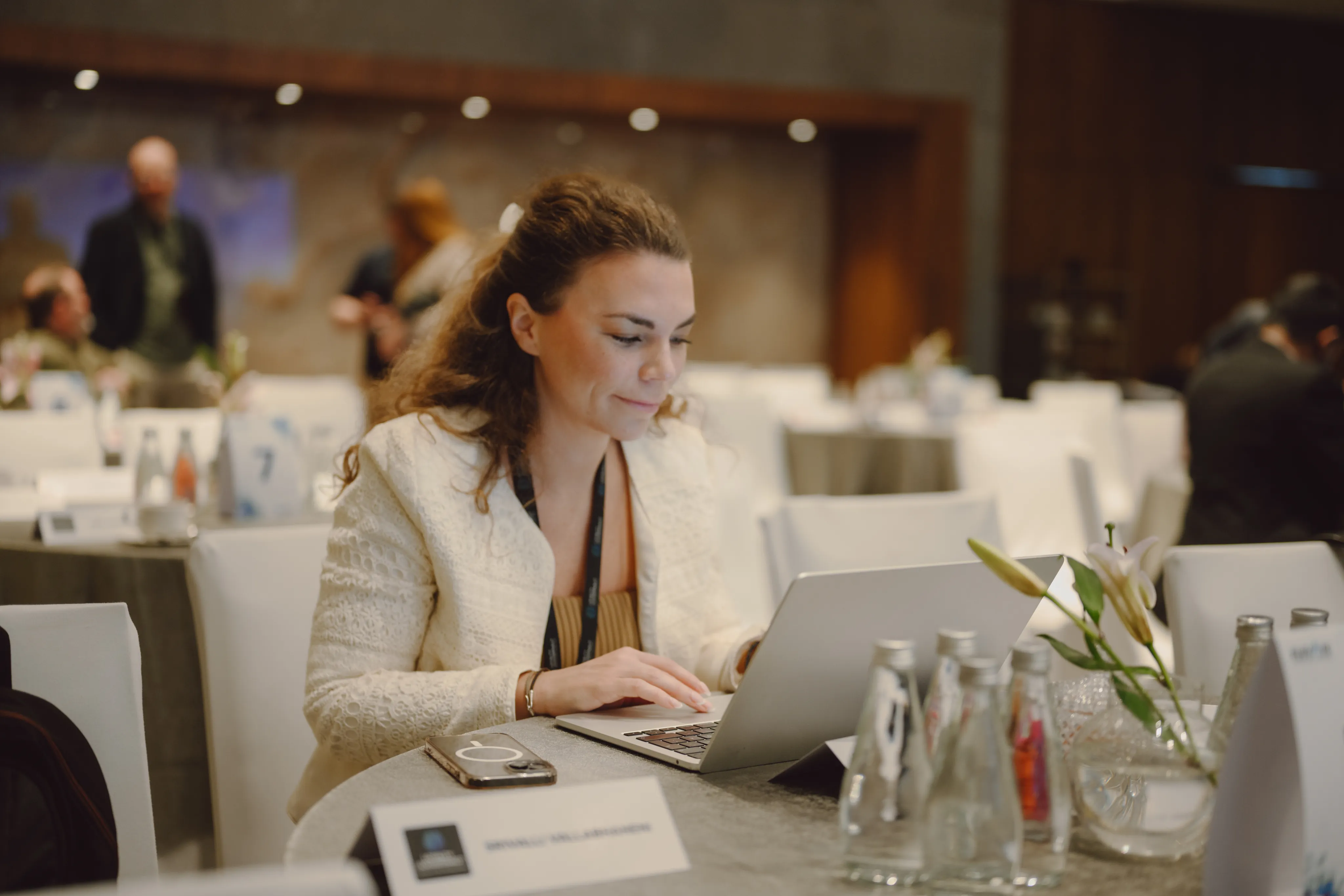A Loyalty Juggernaut team member working on a laptop at a company event